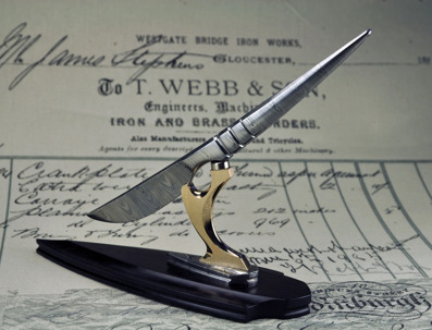 Desk "Scalpel" - Damasteel blade attached witha magnet to a stand made with African Blackwood, Damasteel and Bronze.