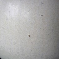 Magnification of pinprick and glaze