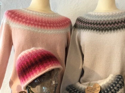 Left "The Pink Flower" pullover behind the Sago Palm hat. Right The Gothic Window Pink behind the Gray Egg pullover.