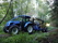 New Holland TD5 med skogsvagn