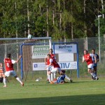 Tryck mot den rödvita buren