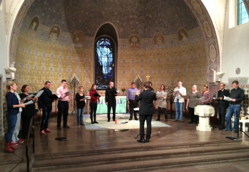 The Eric Ericson Chamber Choir and conductor Fredrik Malmberg during dress rehearsal.