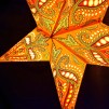 Orange adventsstjärna i kitschig Indisk/Orientalisk stil