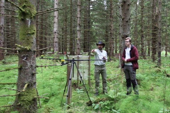 Field assistant Andreas Arleborg (right) and station manager Tobias Rütting (left) set up the Postex system (Haglöf Sweden AB) for measuring tree diameter (using a digital caliper) and exact tree position in the spruce forest at Skogaryd Research Catchment. In total, 10 plots with a radius of 15 m have been measured. (Photo by Leif Klemedtsson)