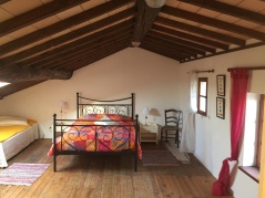 Bedroom upstairs with room for 3-4 pcs. Private bathroom. View of the street and wonderful view of the wine fields in the south