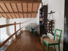 The balcony (mezzanine) in the large family room. 2 sleeping berths. Books and toys.
