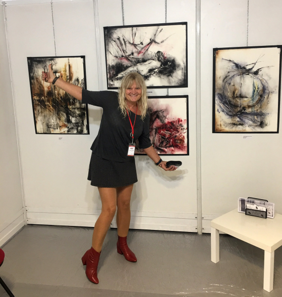 Dana with her artworks Dana with her artworks