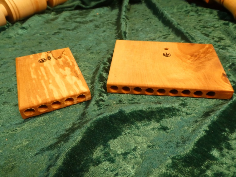 The PAN FLUTE or the YORK FLUTE was found in York during excavations of Viking graves. It is the only instrument in wood found in a chief tomb. It was lying on the chieftain's chest. One half had been washed away by dripping water, so the left one is the reconstruction of the original. The right one is my reconstruction of the original as it probably has looked. The scale is extended to nine notes and the flute hangs straight as the hole sits in the middle. NOTE! Nine notes on the scale were the most common in the Viking era. The price is: 5 notes 100SEK nine notes 250SEK