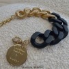 A VANESSA BARONI BIG TANK BLACK GOLD ARMBAND