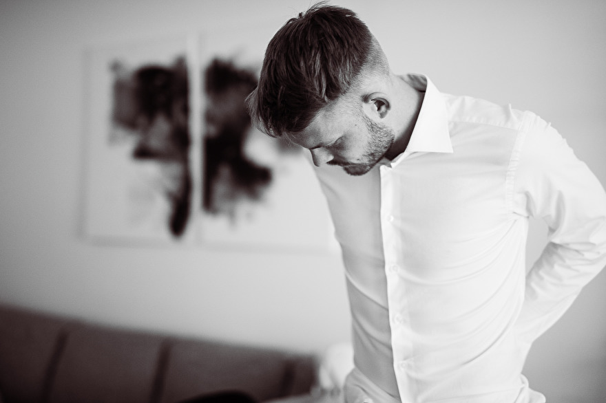 Groom is getting ready for wedding. Photo by Rebecca Wallin Groom is getting ready for wedding. Photo by Rebecca Wallin
