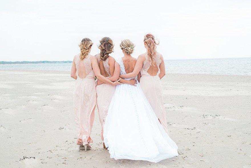 Bride and her bridesmaids on the beach. Photo Rebecca Wallin Bride and her bridesmaids on the beach. Photo Rebecca Wallin