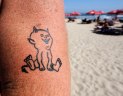Grymmaste tatueringen på Kuta Beach