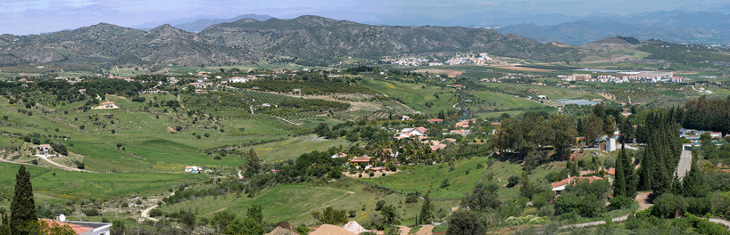 View of the beautiful, flat valley between the Mijas Mountains and the mountains further inland