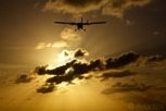 Winair De Havilland Twin Otter over Maho Beach during sunset, Sint Maarten 