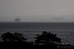 Bad weather passes by the Öresund with a Scandlines ferry and Kronborg Castle in the distance, Helsingborg