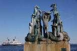 Statue at the harbor with the Scandlines ferry to Sweden in background, Elsinore