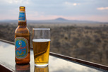 Safari Lager with Serengeti National Park as backdrop
