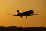 A MD80 about land at Copenhagen/Kastrup at sunset