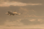Vapour trails and condensation while this McDonnell Douglas MD11 is about to land