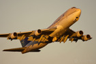 Saudi Arabian Airlines Boeing 747-400 on departure in golden light conditions