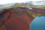 Blue crater hole and red sand cliff, Landmannalaugar