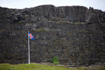 The icelandic flag with Lögberg as backdrop, Þingvellir