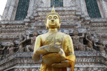 Buddha in front of the Temple of Dawn (Wat Arun), Bangkok
