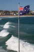 The Australian flag at a windy Bondi Beach, Sydney