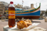 The local soft drink Kinnie together with some pastizzis and qassatats, St Julian