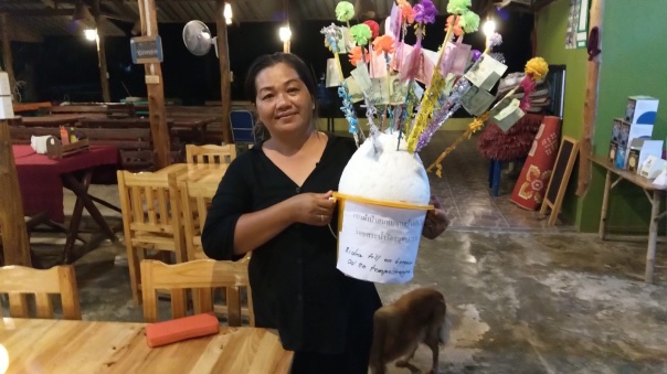 Kaew gives us the opportunity to donate money to the monks in the village